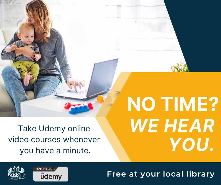 Woman with an infant on her lap. She has the child with one arm and her other hand is using a laptop. She is kissing the child on the head and the photo makes it look like holding an infant and using a computer is easy-peasy. We all know that is a dirty lie.